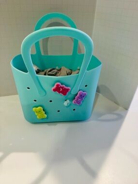 Silicone Baby Bag Mini in “Mint” accessorized w/ a variety of colorful charms.